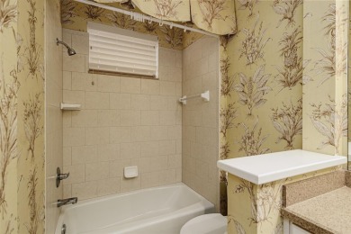 Welcome to this beautiful 3-bedroom, 2-bath lakefront home on Grasslands Golf and Country Club in Florida - for sale on GolfHomes.com, golf home, golf lot