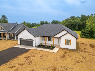 This brand-new construction offers a relaxed and stylish on Russellville Country Club in Kentucky - for sale on GolfHomes.com, golf home, golf lot