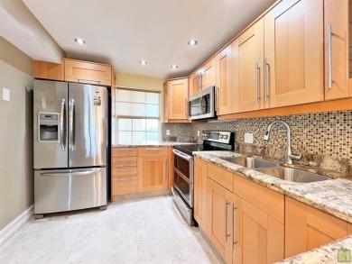 Beautifully updated sixth floor corner unit condo in Palm Aire's on Palm-Aire Country Club and Resort - The Oaks in Florida - for sale on GolfHomes.com, golf home, golf lot