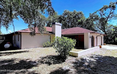 A brand new roof will top this terrific home before closing! on Oak Hills Country Club in Florida - for sale on GolfHomes.com, golf home, golf lot