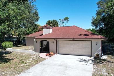 A brand new roof will top this terrific home before closing! on Oak Hills Country Club in Florida - for sale on GolfHomes.com, golf home, golf lot