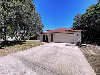 A brand new roof will top this terrific home before closing! on Oak Hills Country Club in Florida - for sale on GolfHomes.com, golf home, golf lot