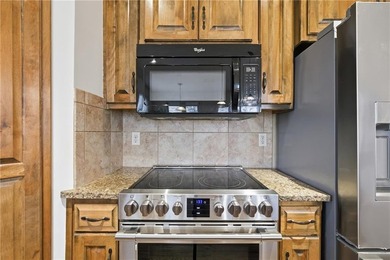 This beautifully updated reverse 1.5-story is just steps from on Prairie Highlands Golf Course in Kansas - for sale on GolfHomes.com, golf home, golf lot