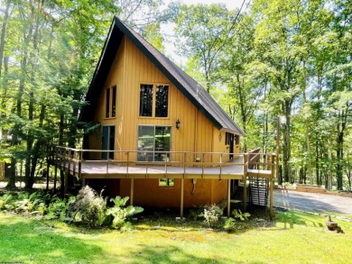 This open concept chalet home is nestled in the woods of Alpine on Alpine Lake Resort in West Virginia - for sale on GolfHomes.com, golf home, golf lot