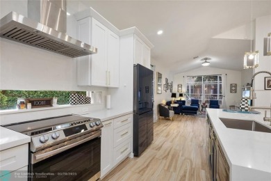 Beautifully updated home on an oversized 14,000 sq. ft. corner on TPC Eagle Trace in Florida - for sale on GolfHomes.com, golf home, golf lot