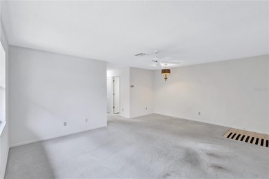 Located in the desirable gated community of Hammock Pine Village on Countryside Country Club in Florida - for sale on GolfHomes.com, golf home, golf lot