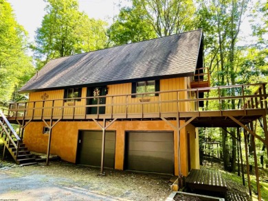 This open concept chalet home is nestled in the woods of Alpine on Alpine Lake Resort in West Virginia - for sale on GolfHomes.com, golf home, golf lot