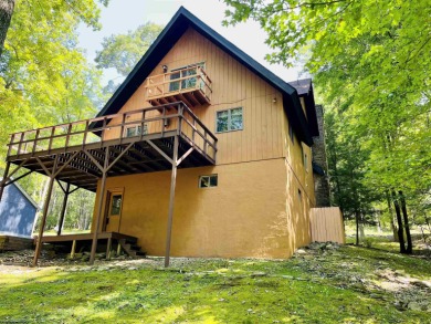 This open concept chalet home is nestled in the woods of Alpine on Alpine Lake Resort in West Virginia - for sale on GolfHomes.com, golf home, golf lot