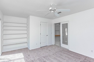 Step into comfort and style with this spacious 4-bedroom, 2 on London Bridge Golf Course in Arizona - for sale on GolfHomes.com, golf home, golf lot