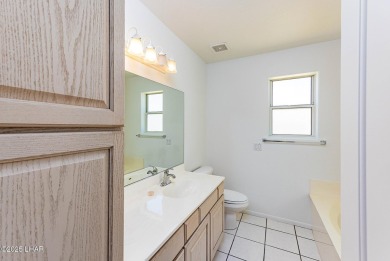 Step into comfort and style with this spacious 4-bedroom, 2 on London Bridge Golf Course in Arizona - for sale on GolfHomes.com, golf home, golf lot
