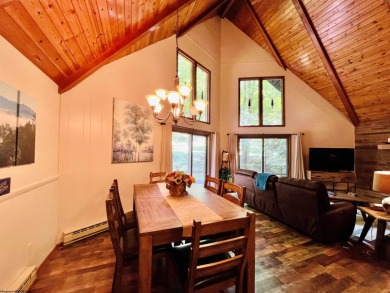 This open concept chalet home is nestled in the woods of Alpine on Alpine Lake Resort in West Virginia - for sale on GolfHomes.com, golf home, golf lot