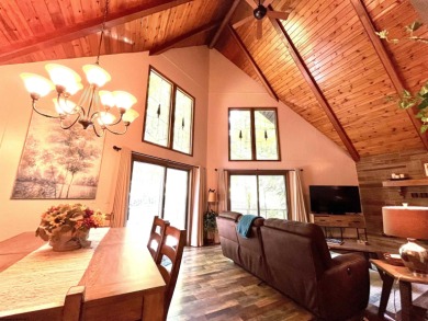 This open concept chalet home is nestled in the woods of Alpine on Alpine Lake Resort in West Virginia - for sale on GolfHomes.com, golf home, golf lot