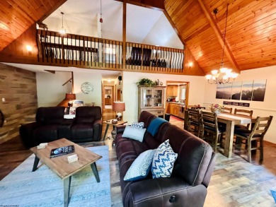 This open concept chalet home is nestled in the woods of Alpine on Alpine Lake Resort in West Virginia - for sale on GolfHomes.com, golf home, golf lot