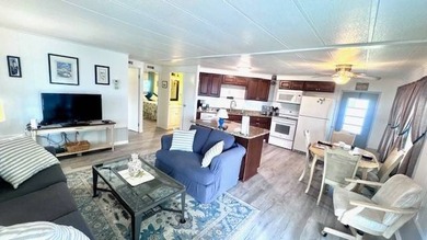 This charming 2-bedroom, 1.5-bath manufactured home offers on Riverbend Golf and Country Club in Florida - for sale on GolfHomes.com, golf home, golf lot