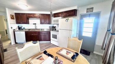 This charming 2-bedroom, 1.5-bath manufactured home offers on Riverbend Golf and Country Club in Florida - for sale on GolfHomes.com, golf home, golf lot