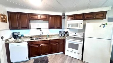 This charming 2-bedroom, 1.5-bath manufactured home offers on Riverbend Golf and Country Club in Florida - for sale on GolfHomes.com, golf home, golf lot