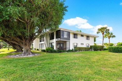 Stunning 2-Bedroom, 2-Bathroom Residence with Wrap-Around Lake on Quail Ridge Golf Course and Country Club in Florida - for sale on GolfHomes.com, golf home, golf lot