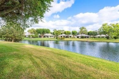 Stunning 2-Bedroom, 2-Bathroom Residence with Wrap-Around Lake on Quail Ridge Golf Course and Country Club in Florida - for sale on GolfHomes.com, golf home, golf lot