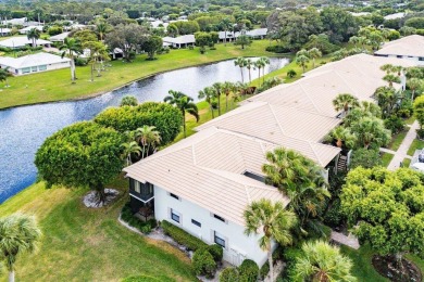 Stunning 2-Bedroom, 2-Bathroom Residence with Wrap-Around Lake on Quail Ridge Golf Course and Country Club in Florida - for sale on GolfHomes.com, golf home, golf lot