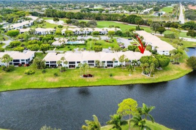 Stunning 2-Bedroom, 2-Bathroom Residence with Wrap-Around Lake on Quail Ridge Golf Course and Country Club in Florida - for sale on GolfHomes.com, golf home, golf lot