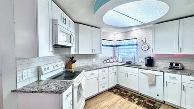 Welcome to this beautifully updated 2-bedroom, 2-bath on Riverbend Golf and Country Club in Florida - for sale on GolfHomes.com, golf home, golf lot