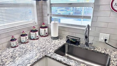 Welcome to this beautifully updated 2-bedroom, 2-bath on Riverbend Golf and Country Club in Florida - for sale on GolfHomes.com, golf home, golf lot