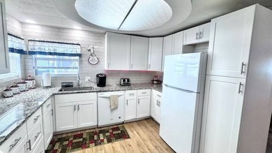 Welcome to this beautifully updated 2-bedroom, 2-bath on Riverbend Golf and Country Club in Florida - for sale on GolfHomes.com, golf home, golf lot