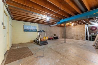This 2 BED 3 BATH 2000 sq ft RANCH home is nestled  on a wooded on Lakes of the Four Seasons Country Club in Indiana - for sale on GolfHomes.com, golf home, golf lot