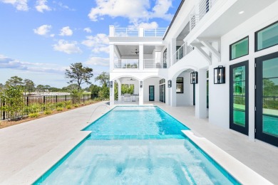 Pristine architectural design, paired with sweeping golf course on Santa Rosa Golf and Beach Club in Florida - for sale on GolfHomes.com, golf home, golf lot