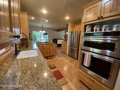 Nestled in a park-like setting just minutes from Pinehurst Golf on Pinehurst Golf Course in Idaho - for sale on GolfHomes.com, golf home, golf lot