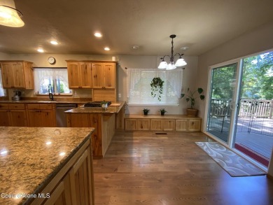 Nestled in a park-like setting just minutes from Pinehurst Golf on Pinehurst Golf Course in Idaho - for sale on GolfHomes.com, golf home, golf lot