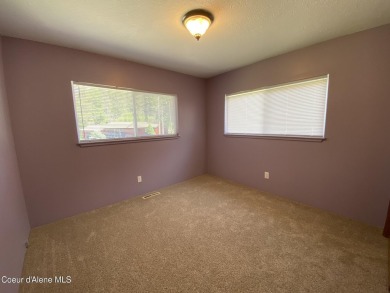 Nestled in a park-like setting just minutes from Pinehurst Golf on Pinehurst Golf Course in Idaho - for sale on GolfHomes.com, golf home, golf lot