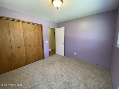 Nestled in a park-like setting just minutes from Pinehurst Golf on Pinehurst Golf Course in Idaho - for sale on GolfHomes.com, golf home, golf lot