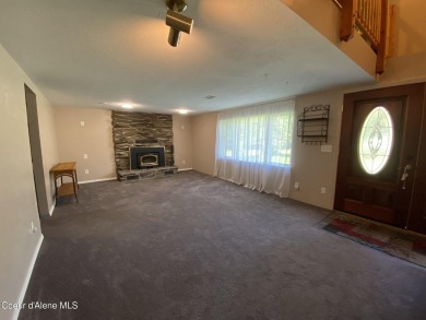 Nestled in a park-like setting just minutes from Pinehurst Golf on Pinehurst Golf Course in Idaho - for sale on GolfHomes.com, golf home, golf lot