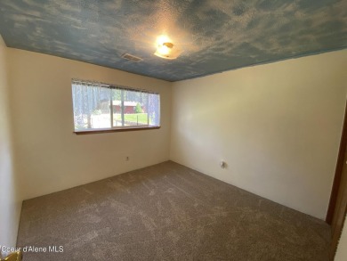 Nestled in a park-like setting just minutes from Pinehurst Golf on Pinehurst Golf Course in Idaho - for sale on GolfHomes.com, golf home, golf lot