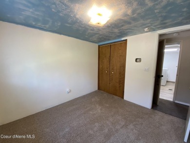 Nestled in a park-like setting just minutes from Pinehurst Golf on Pinehurst Golf Course in Idaho - for sale on GolfHomes.com, golf home, golf lot