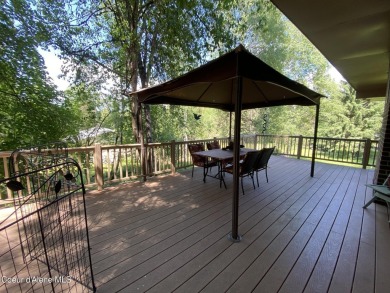 Nestled in a park-like setting just minutes from Pinehurst Golf on Pinehurst Golf Course in Idaho - for sale on GolfHomes.com, golf home, golf lot