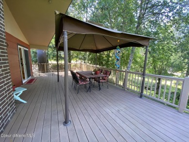 Nestled in a park-like setting just minutes from Pinehurst Golf on Pinehurst Golf Course in Idaho - for sale on GolfHomes.com, golf home, golf lot