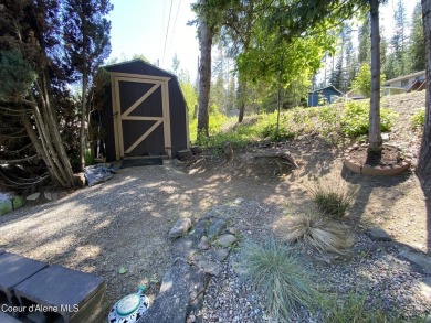 Nestled in a park-like setting just minutes from Pinehurst Golf on Pinehurst Golf Course in Idaho - for sale on GolfHomes.com, golf home, golf lot
