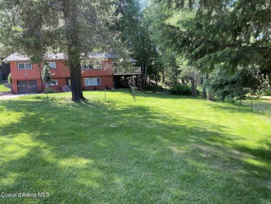 Nestled in a park-like setting just minutes from Pinehurst Golf on Pinehurst Golf Course in Idaho - for sale on GolfHomes.com, golf home, golf lot