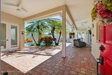 Beautifully updated 1994 Palmwood Bahama Breeze courtyard pool on Glen Lakes Country Club in Florida - for sale on GolfHomes.com, golf home, golf lot
