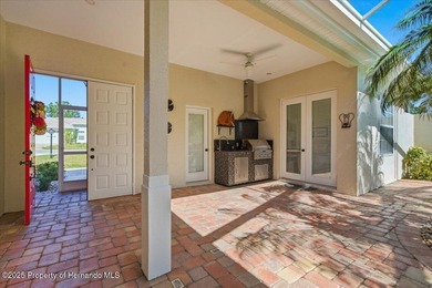 Beautifully updated 1994 Palmwood Bahama Breeze courtyard pool on Glen Lakes Country Club in Florida - for sale on GolfHomes.com, golf home, golf lot