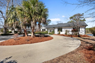 Tucked along a peaceful deep-water canal in the sought-after on Olde Point Golf and Country Club in North Carolina - for sale on GolfHomes.com, golf home, golf lot