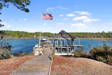 Tucked along a peaceful deep-water canal in the sought-after on Olde Point Golf and Country Club in North Carolina - for sale on GolfHomes.com, golf home, golf lot