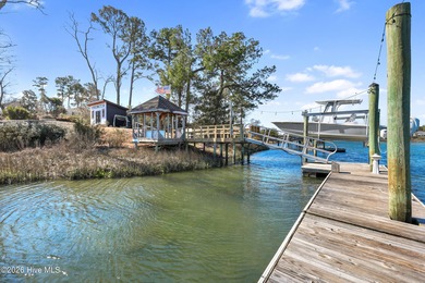 Tucked along a peaceful deep-water canal in the sought-after on Olde Point Golf and Country Club in North Carolina - for sale on GolfHomes.com, golf home, golf lot