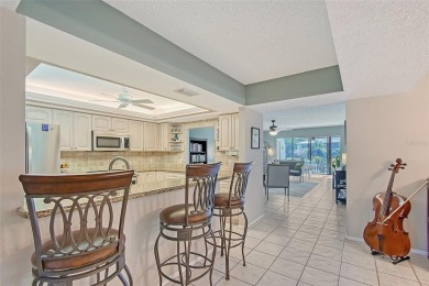 Welcome to Your Lakeside Paradise at 6472 Seagull Terrace #301 on IMG Academies Golf and Country Club in Florida - for sale on GolfHomes.com, golf home, golf lot