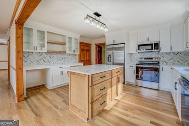 Welcome to this beautifully renovated lakefront home located in on Turtle Cove Golf Course in Georgia - for sale on GolfHomes.com, golf home, golf lot