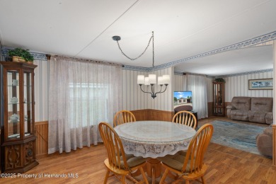 Step into this beautifully maintained 4-bedroom, 2-bathroom home on High Point Golf Club, Inc. in Florida - for sale on GolfHomes.com, golf home, golf lot