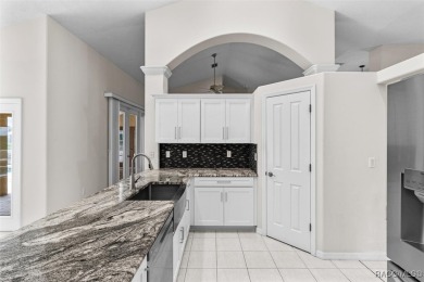 Step into luxury with this stunning 3-bedroom, 2.5-bath home on LakeSide Country Club in Florida - for sale on GolfHomes.com, golf home, golf lot