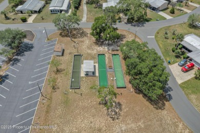 Step into this beautifully maintained 4-bedroom, 2-bathroom home on High Point Golf Club, Inc. in Florida - for sale on GolfHomes.com, golf home, golf lot